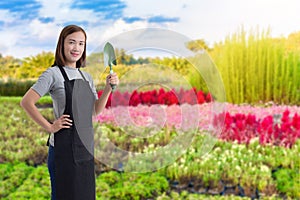 Portrait of Female gardener hand holding shovel