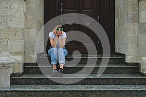 Portrait of female hipster with natural makeup and short haircut enjoying leisure time outdoors