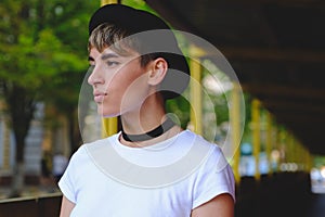 Portrait of female hipster with natural makeup and short haircut enjoying leisure time outdoors