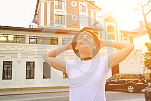 Portrait of female hipster with natural makeup and short haircut enjoying leisure time outdoors