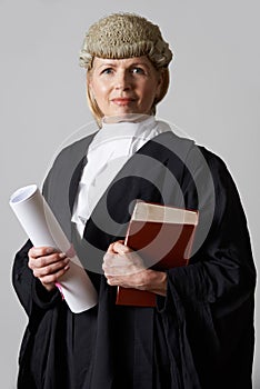 Portrait Of Female Lawyer Holding Brief And Book