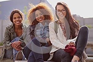 Portrait, female learners and friends of campus, break and relax for classes at university. Face, happy and diversity at