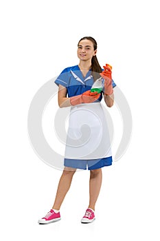 Portrait of female made, cleaning worker in white and blue uniform isolated over white background