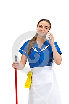 Portrait of female made, cleaning worker in white and blue uniform isolated over white background