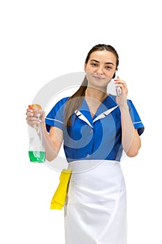 Portrait of female made, cleaning worker in white and blue uniform isolated over white background