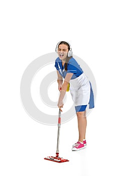 Portrait of female made, cleaning worker in white and blue uniform isolated over white background