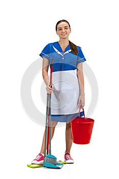 Portrait of female made, cleaning worker in white and blue uniform isolated over white background