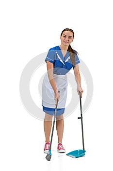 Portrait of female made, cleaning worker in white and blue uniform isolated over white background