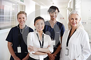 Portrait Of Female Medical Team Standing In Hospital Corridor
