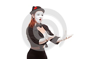 Portrait of a female mime artist performing, isolated on white background. Symbol of perturbation, indignation, question