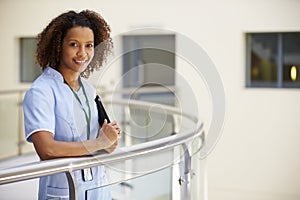 Portrait Of Female Nurse With Digital Tablet In Hospital