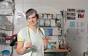 Portrait female nurse in ICU in green uniform.