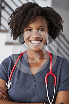 Portrait Of Female Nurse Wearing Scrubs In Hospital