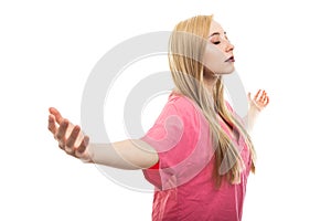 Portrait of female nurse wearing scrubs making winner gesture