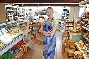 Portrait Of Female Owner Of Delicatessen Standing In Shop