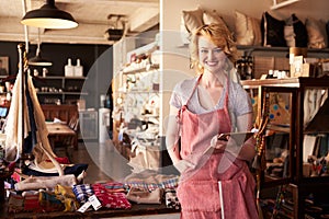 Portrait Of Female Owner Of Gift Store With Digital Tablet