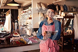 Portrait Of Female Owner Of Gift Store With Digital Tablet photo