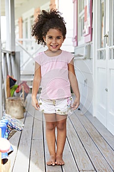 Portrait Of Female Pupil Outside Classroom At Montessori School