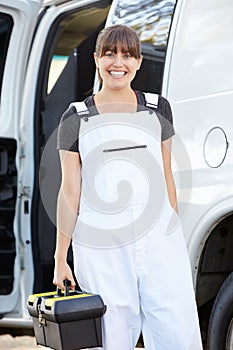 Portrait Of Female Repair Person With Van