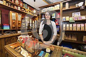Portrait of female salesperson working in coffee shop