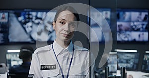 Portrait of female security worker looking at camera