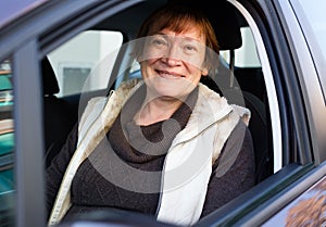 Portrait of female senior driver in car
