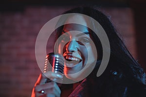 Portrait of female singer performing in nightclub