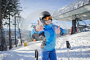 Portrait of female skier on the top of ski slope