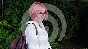 Portrait of a female student with pink hair