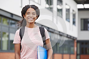 Portrait Of Female Student Standing Outside College Building