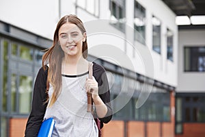 Portrait Of Female Student Standing Outside College Building