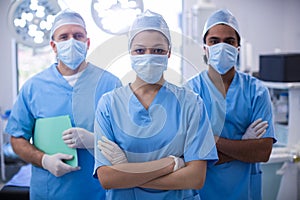 Portrait of female surgeon standing with arms crossed in operation room