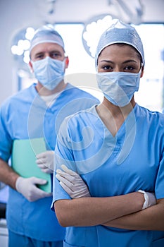 Portrait of female surgeon standing with arms crossed in operation room