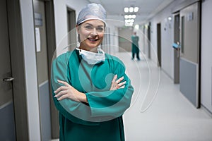 Portrait of female surgeon standing in corridor