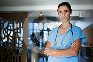 Portrait of female surgeon standing in hospital