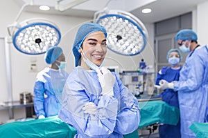 Portrait of female surgeon standing in operating room, ready to work on a patient. Woman medical worker surgical uniform in