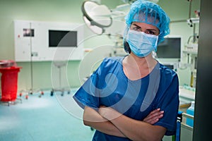 Portrait of a female surgeon standing in operation room