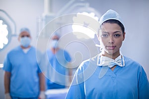 Portrait of female surgeon standing in operation room