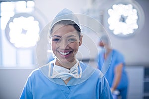 Portrait of female surgeon standing in operation room