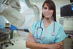 Portrait of female surgeon standing in operation theater