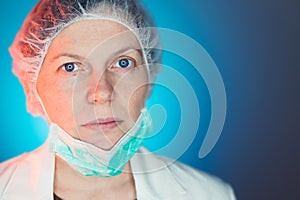 Portrait of female surgeon wearing protective surgical mask