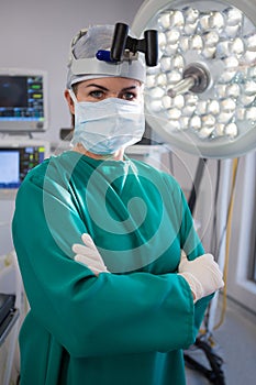 Portrait of female surgeon wearing surgical loupes