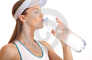 Portrait of a female tennis player drinking water