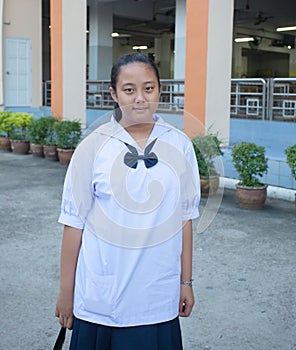 Portrait of female thai high school student in uiform photo