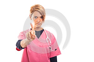 Portrait of female vet showing index finger like denial