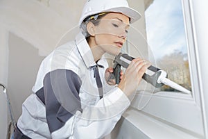 portrait female window installer