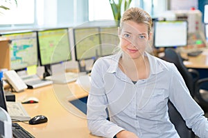 Portrait female worker in computer control center
