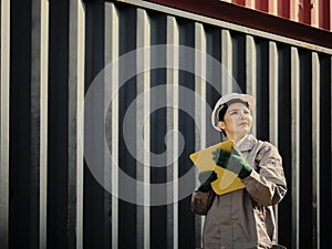 Portrait of a female worker holding clipboard