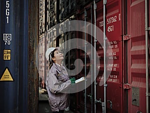 Portrait of a female worker holding clipboard