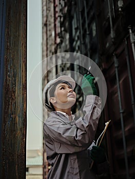 Portrait of a female worker holding clipboard